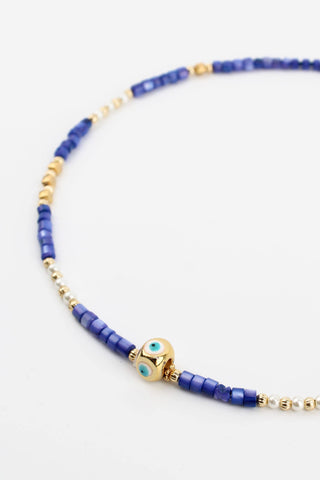 BLUE BEADED AND GOLD EYE CHARM NECKLACE