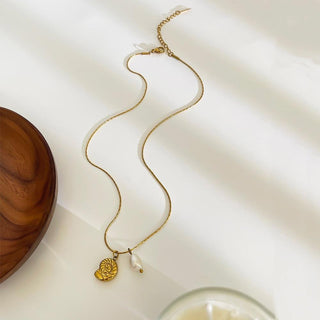 Spiral shell & pearl fine chain necklace in gold